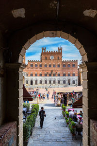 Piazza del campo in siena from a vault passage