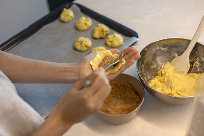 Making hotteok with sugar before baking, shape dough into a ball by hands