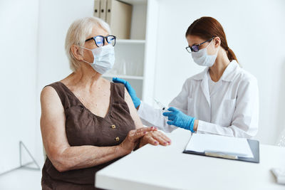 Midsection of woman working in laptop