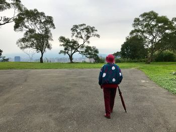 Full length rear view of a senior woman