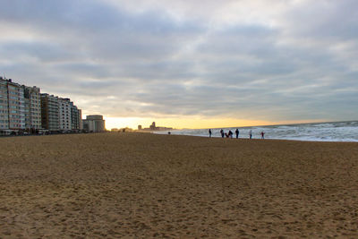 Scenic view of beach against sky during sunset