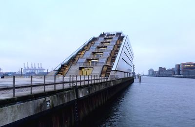 Bridge over river against clear sky