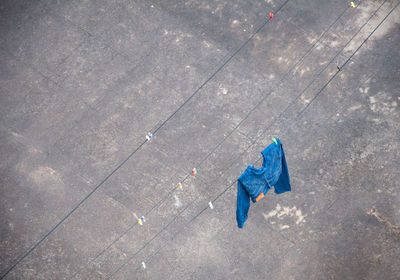 High angle view of umbrella on wet street