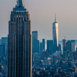 Modern buildings in city against sky