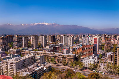 High angle view of buildings in city against clear sky