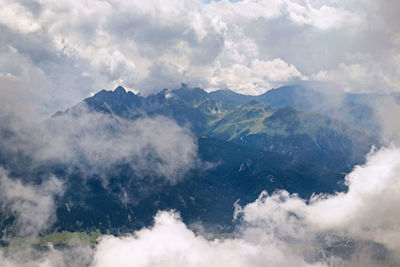 Aerial view of majestic mountains against sky