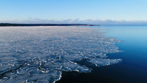 Scenic view of frozen sea against sky