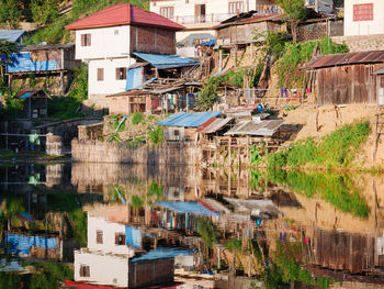 High angle view of houses by lake in town