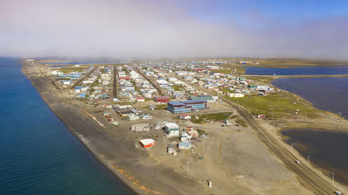 High angle view of harbor by sea against sky