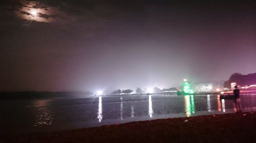 Scenic view of sea against sky at night