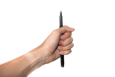 Cropped hand holding pen against white background