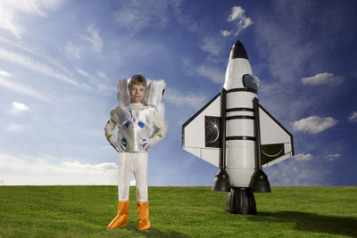 Man standing on field against sky