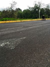 Person riding bicycle on road