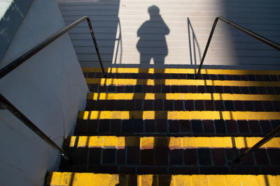 High angle view of person standing on staircase