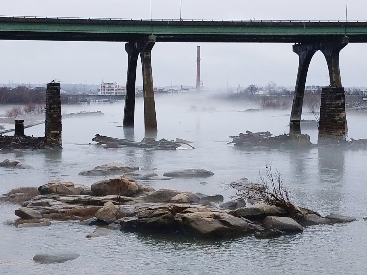 VIEW OF BRIDGE OVER RIVER AGAINST SKY