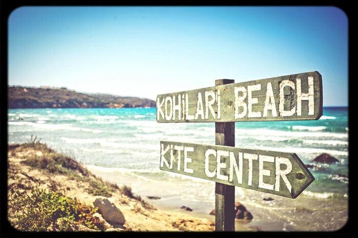 text, western script, communication, clear sky, blue, water, sea, sign, information sign, beach, capital letter, guidance, transfer print, warning sign, copy space, information, auto post production filter, shore, sand, sky