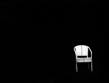 Close-up of lamp over black background