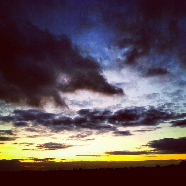 sunset, sky, scenics, tranquil scene, cloud - sky, beauty in nature, tranquility, landscape, silhouette, cloudy, dramatic sky, nature, cloud, idyllic, field, moody sky, weather, orange color, overcast, atmospheric mood