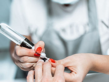 Close-up of woman holding hands