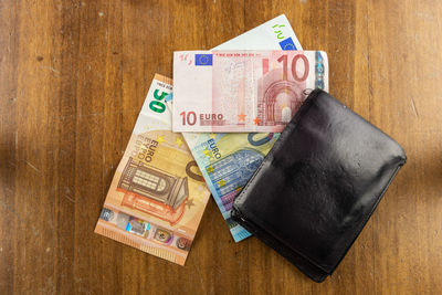 High angle view of coins on table