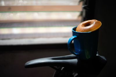 Close-up of coffee cup on table