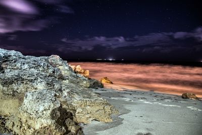 Scenic view of sea against sky at night
