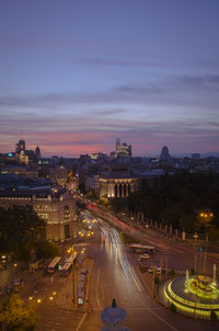 High angle view of light trails on road during dusk