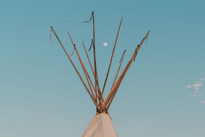 Low angle view of tent against clear blue sky