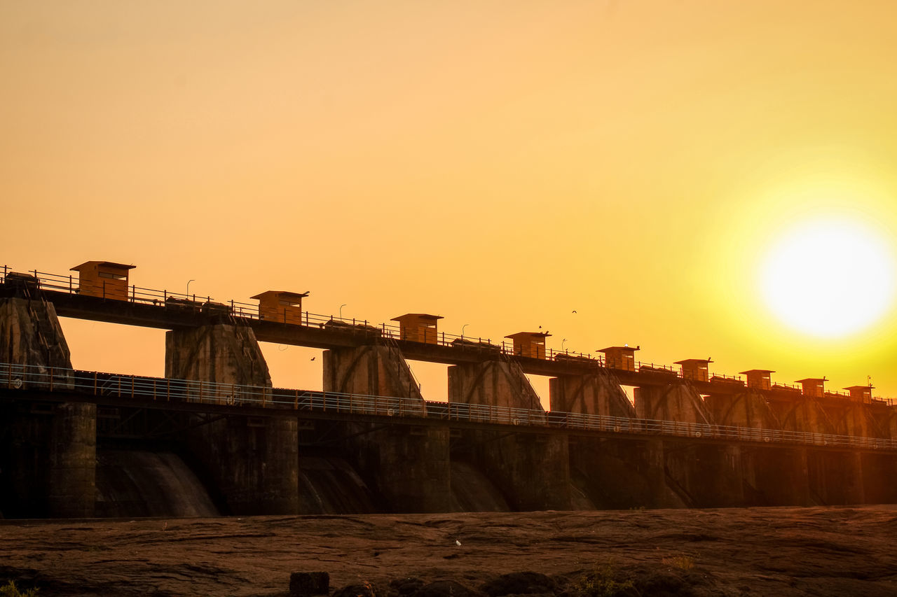 VIEW OF DAM AT SUNSET