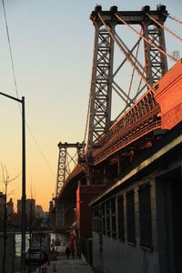 Low angle view of bridge against sky during sunset