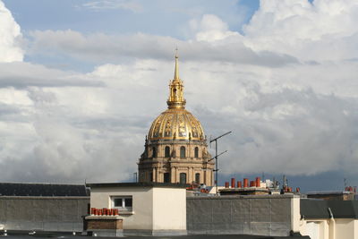 St-louis-des-invalides against cloudy sky in city