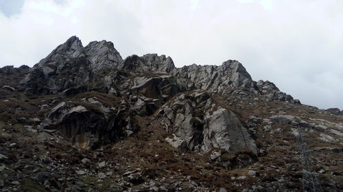 Scenic view of mountains against cloudy sky