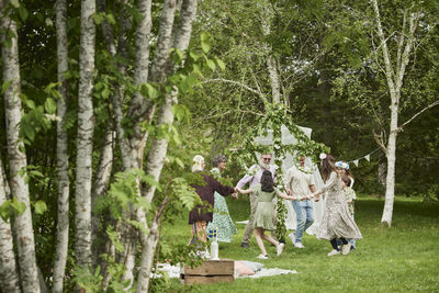 People dancing around maypole