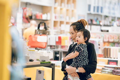 Boy standing in store