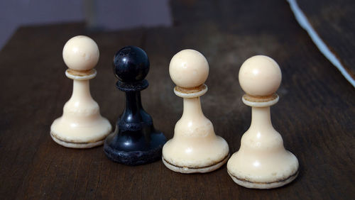 Close-up of chess pieces on table