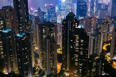 Aerial view of illuminated buildings in city at night