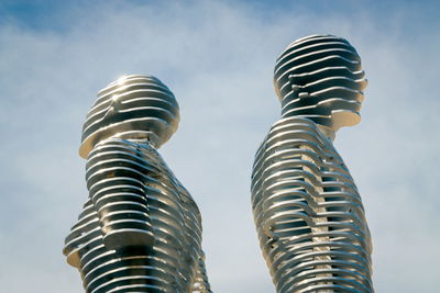 Low angle view of modern sculpture against sky