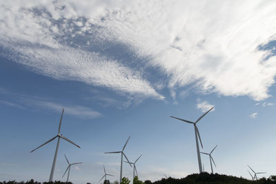 Low angle view of windmill against sky