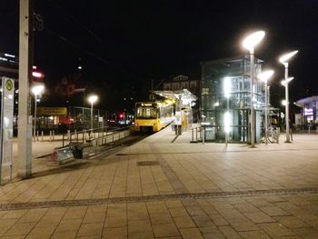 Illuminated city street at night