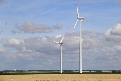 Wind turbines in field