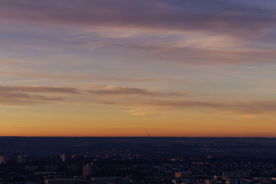 High angle view of buildings against sky during sunset