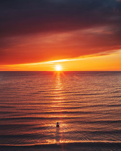 Scenic view of boat in the baltic sea against sky during sunset