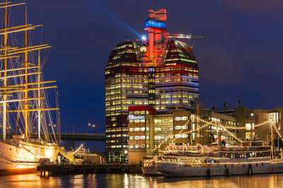 Illuminated skyscrape at gothenburg harbor