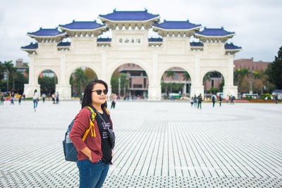 Woman in front of historical building