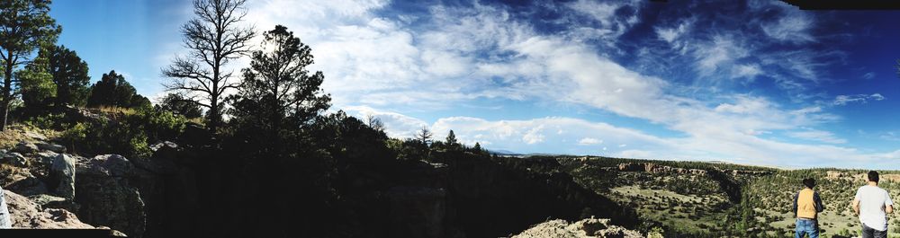 Scenic view of mountains against cloudy sky