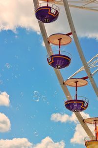 Low angle view of ferris wheel against sky