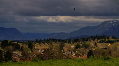 Scenic view of mountains against storm clouds
