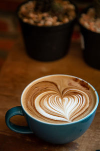 Close-up of cappuccino on table