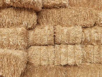 Full frame shot of hay bales on landscape