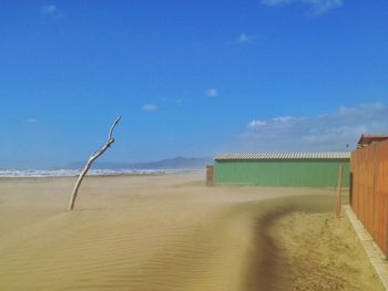 Beach huts against blue sky